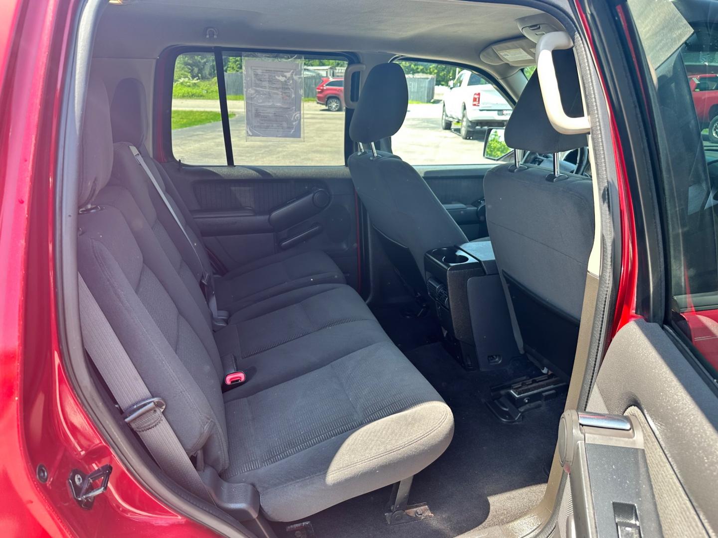 2009 Red /black Ford Explorer XLT (1FMEU73E89U) with an 4.0L V6 engine, 5-Speed Automatic transmission, located at 11115 Chardon Rd. , Chardon, OH, 44024, (440) 214-9705, 41.580246, -81.241943 - This 2009 Ford Explorer is a reliable and capable SUV, offering a 4.0L V6 engine paired with a 5-speed automatic transmission and full-time 4WD system. With a 3,500-pound towing capacity, it's suitable for moderate hauling needs. Additionally, the power driver's seat provides comfort and convenience - Photo#38